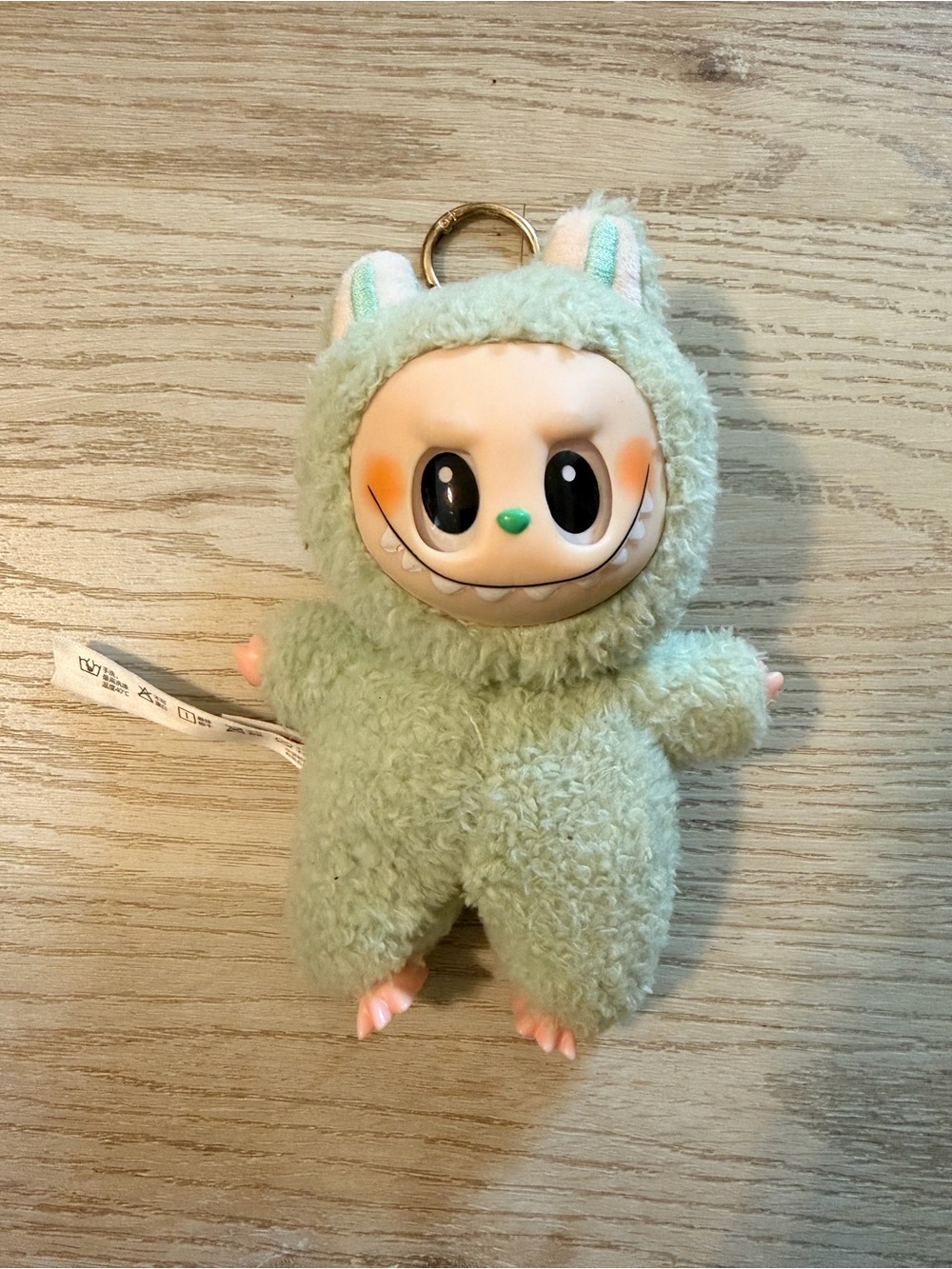 Pop Mart Labubu The Monsters keychain in Green Grape